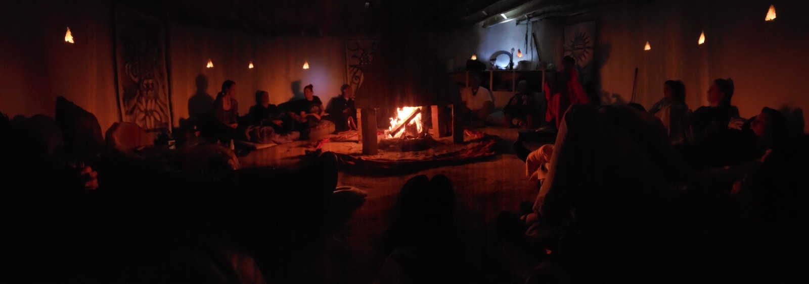 Participants gathered inside the ceremonial lodge at a Plant Medicine University retreat in New Mexico